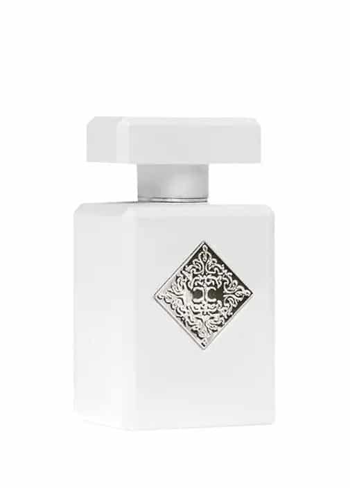 Product photograph of Initio Parfums Privés' white rectangular perfume bottle featuring a prominent silver ornate emblem, a sleek silver neck, and a geometric white cap