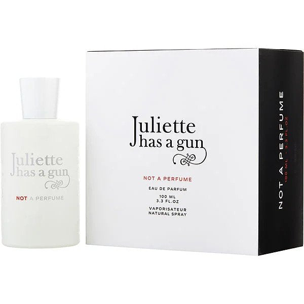 Juliette Has A Gun Not A Perfume Eau de Parfum 100ml, featuring a minimalist matte white bottle with red 'NOT A PERFUME' text, paired with its elegant white box displaying black branding and a bold black side panel
