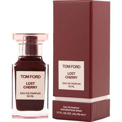 Product photo by Tom Ford of a Lost Cherry Eau de Parfum 50ml bottle with dark red liquid and light pink cap standing next to its matching textured reddish-brown box on a white background