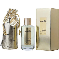 Product photography of a Mancera Paris Wave Musk Eau de Parfum 120ml set featuring a clear glass bottle with a gold cap, a matching shiny gold rectangular box, and a gold drawstring pouch with repeated "M" logos