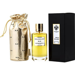 Mancera Paris Vanille Exclusive perfume set showing a 120ml clear glass bottle of amber liquid with a gold cap, a black rectangular box featuring a white label and iris logo, and a shiny gold drawstring pouch patterned with the repeating M logo