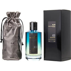 Product Photography of a Mancera Aoud Blue Notes perfume set featuring a gradient blue glass bottle, a black rectangular box, and a metallic grey satin drawstring pouch embossed with repeating 'M' logos on a white studio background