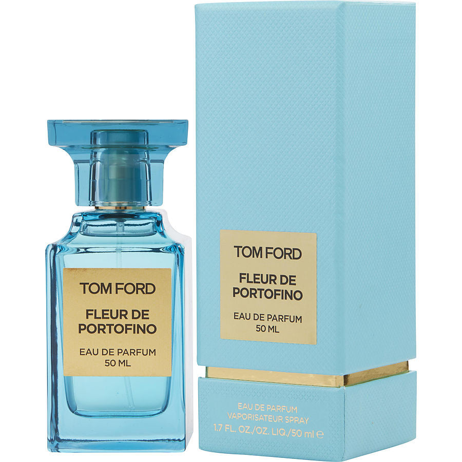 Product photograph of Tom Ford Fleur de Portofino Eau de Parfum 50ml, featuring a translucent light blue glass bottle with a matching ridged cap, alongside its light blue rectangular box with a gold base and gold labels
