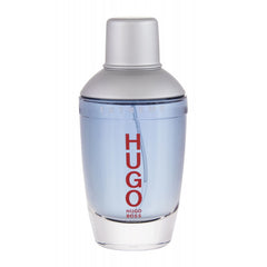 Photography of a Hugo Extreme by Hugo Boss fragrance bottle containing light blue liquid, featuring a metallic silver cap and bold red vertical HUGO lettering on a clean white background