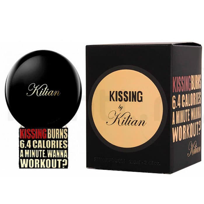 Product image by Kilian featuring the Kissing by Kilian fragrance with its glossy black spherical bottle adorned with gold script and matching black box featuring a gold circular label and the text KISSING BURNS 6.4 CALORIES A MINUTE WANNA WORKOUT
