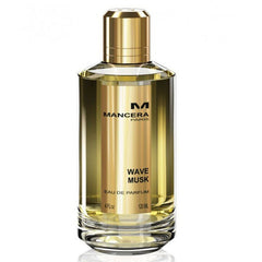 Product photography of a Mancera Wave Musk Eau de Parfum bottle with golden liquid, a metallic gold cap, and a gold label displaying the fragrance name