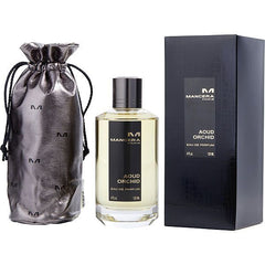 Mancera Aoud Orchid perfume set featuring a silver metallic drawstring pouch with 'M' logos, a clear glass bottle of golden liquid perfume with a black label stating 'Mancera Paris Aoud Orchid Eau de Parfum', and a matching black rectangular presentation box on a plain studio background
