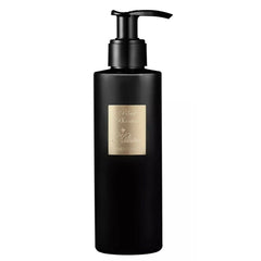 Kilian product photography featuring a Black Phantom matte black pump bottle and gold label with MEMENTO MORI text