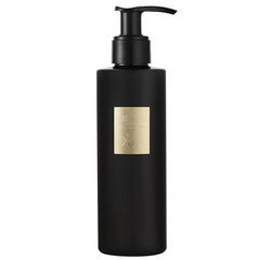 Photograph of By Kilian Moonlight in Heaven matte black pump bottle featuring a gold rectangular label with the product name