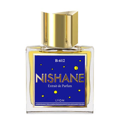 Nishane B-612 Extrait de Parfum bottle with a shiny gold cap, yellow fragrance liquid, and a deep blue label featuring large gold NISHANE text, small yellow stars, a crescent moon, and the word Lyon, listing notes including lavender, sandalwood, and musk