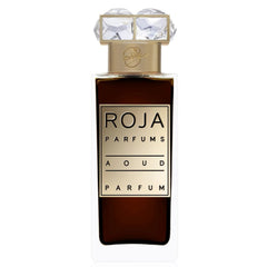 Roja Parfums Aoud Parfum bottle featuring dark amber liquid within a clear rectangular glass, a prominent gold label with black text, and an ornate faceted crystal stopper