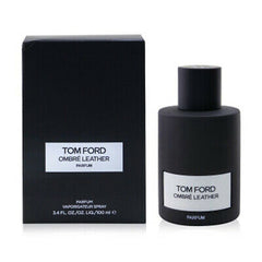 Product photograph Tom Ford Ombré Leather Parfum, showing the 100ml matte black cylindrical bottle and matching rectangular box with prominent white labels on a clean white background