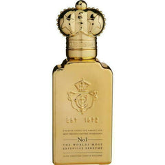 Product photograph of a Clive Christian No1 perfume bottle, created in London England, showcasing its luxurious gold finish, elaborate crown stopper, and embossed text declaring it The Worlds Most Expensive Perfume