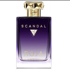 Roja Parfums Scandal perfume bottle in a striking deep purple to clear gradient glass featuring a textured gold geometric cap with a signature and a dazzling silver crystal triangle emblem on the front