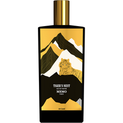 Memo Paris Tiger's Nest Eau de Parfum bottle showcasing a bold gold and black mountain design with a stylized golden tiger evoking Bhutan's iconic Paro Taktsang Monastery topped with a gleaming gold cap