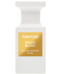 Product photography by Tom Ford of a distinctive white opaque Soleil Blanc Eau de Parfum bottle with an architectural cap and a metallic gold label indicating 50 ML
