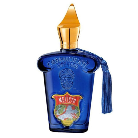 Xerjoff Casamorati Mefisto perfume bottle, a luxurious deep cobalt blue glass with a gold pointed cap, an attached blue tassel, and a prominent red and gold shield label displaying MEFISTO and a world map design on a white background