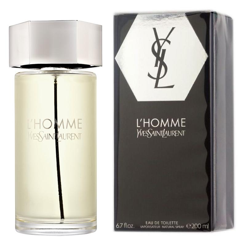 Product photograph of Yves Saint Laurent L'Homme Eau de Toilette for men showcasing its clear glass bottle with light golden liquid and silver hexagonal cap next to its black box packaging featuring the silver YSL monogram and bold L'HOMME Yves Saint Laurent branding